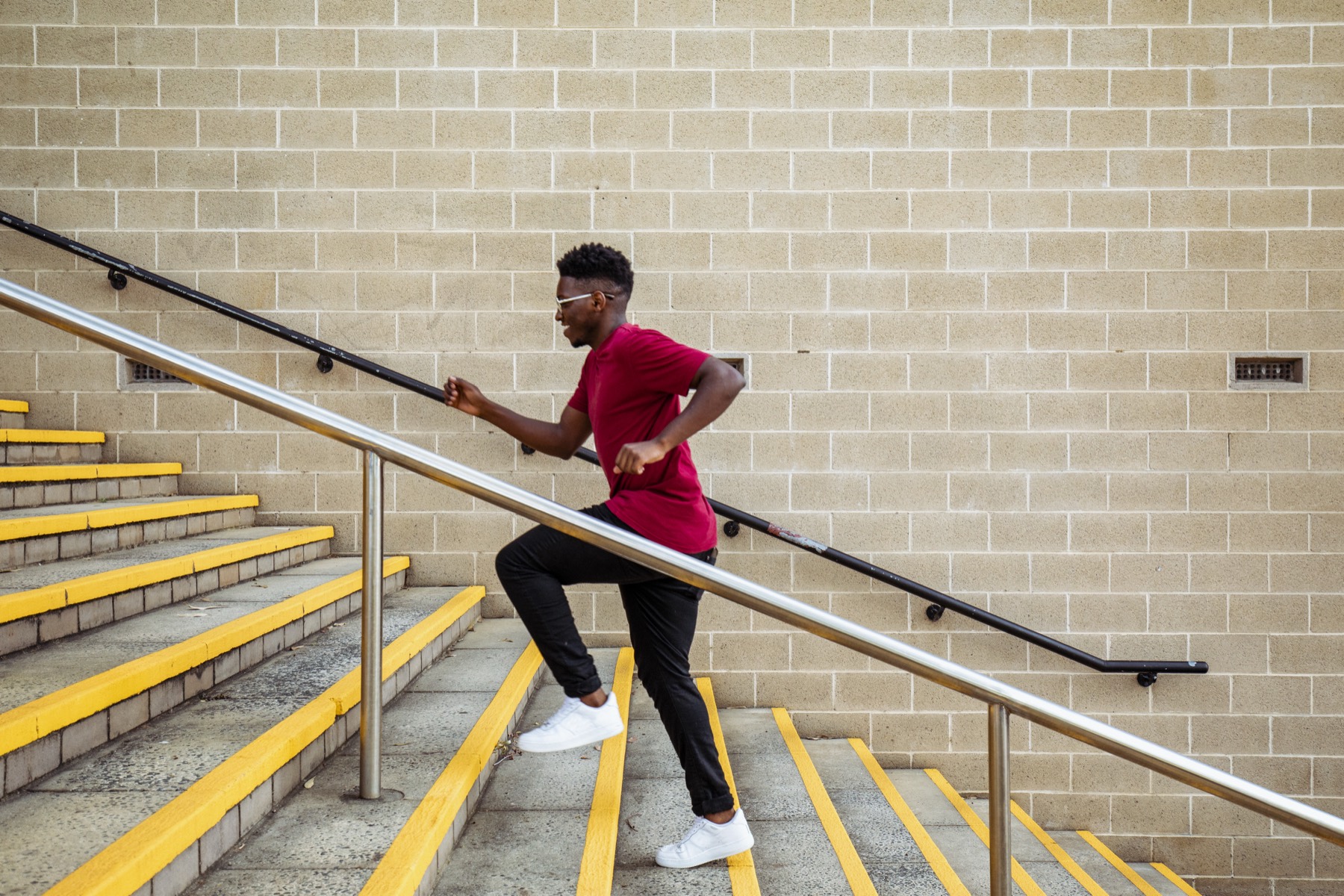 A student climbing a staircase, one step at a time